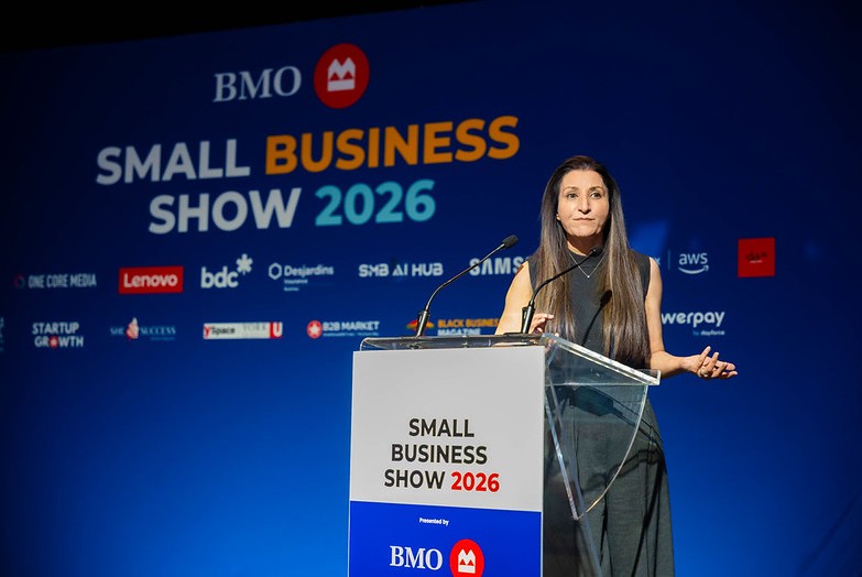 A speaker on stage at the Small Business Show